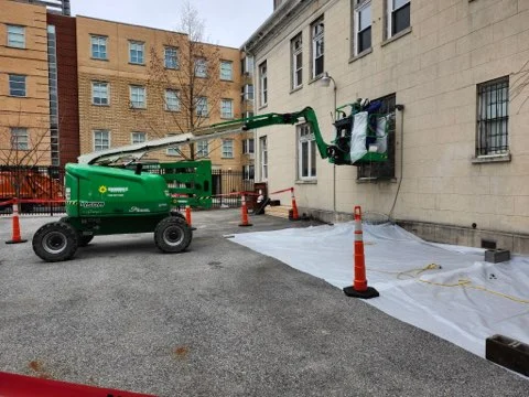 Green lift equipment and containment sheeting at historic building asbestos removal project
